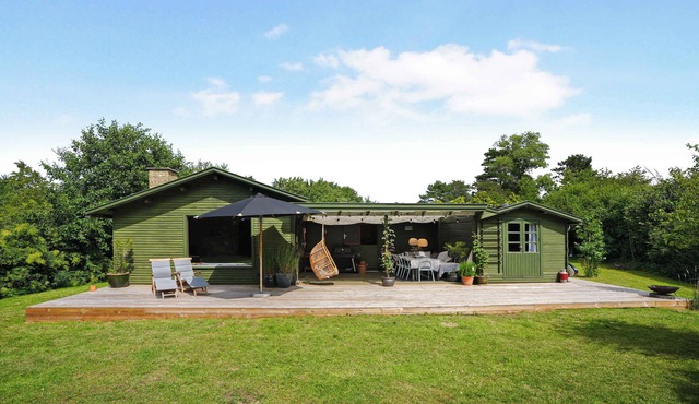 Classic danish summerhouse close to ocean, beach and forest