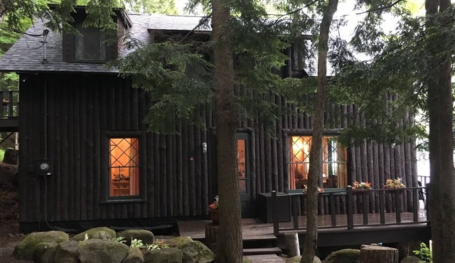 Classic Dryland ADK Boathouse On The Shore Of Long Lake