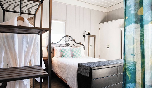Clean and cozy barn home nestled in the trees with peaceful outdoor spaces!
