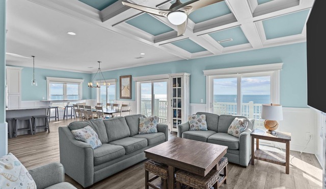 Clear Skies: Spacious 7-Bedroom Oceanfront Retreat in Oak Island, NC, perfect for up to 20 guests.