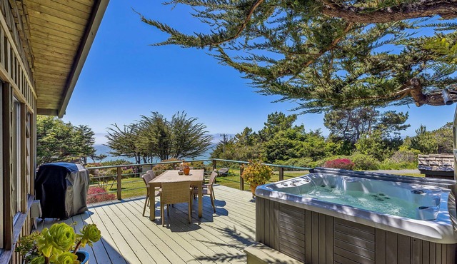 Coastal cliffside hideaway with yard, hot tub, & wood fireplace - dog-friendly