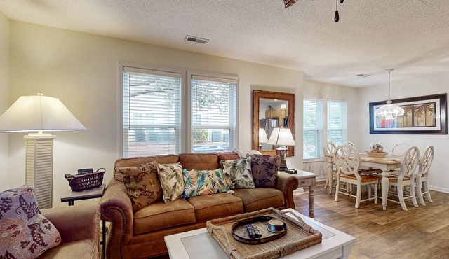 Coastal Condo with golf course view and shared pool access
