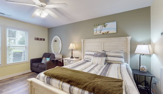 Coastal Condo with golf course view and shared pool access