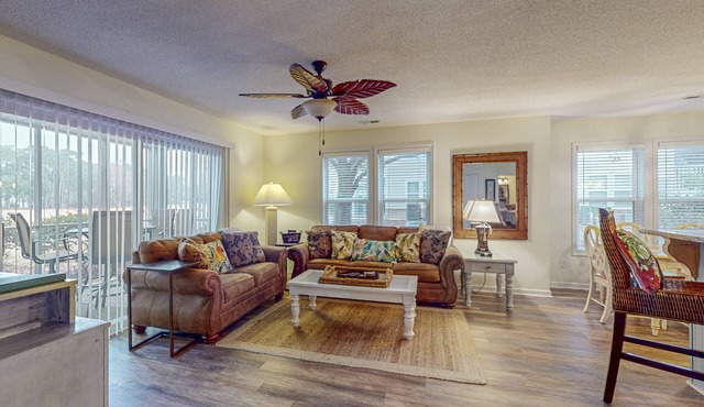 Coastal Condo with golf course view and shared pool access