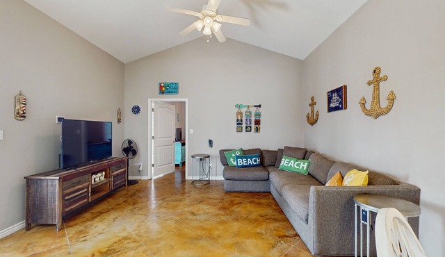 Coastal, dog-friendly townhouse with shared pool & large yard - steps to sand