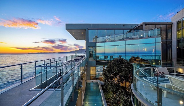 Coastal Masterpiece with Expansive Beachfront & Luxury Amenities