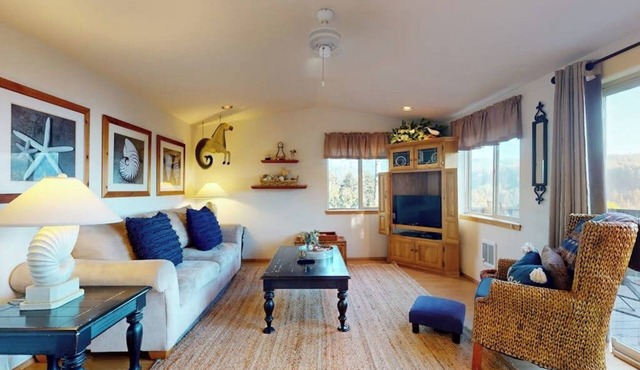 Coastal retreat steps from the beach with a nautical theme