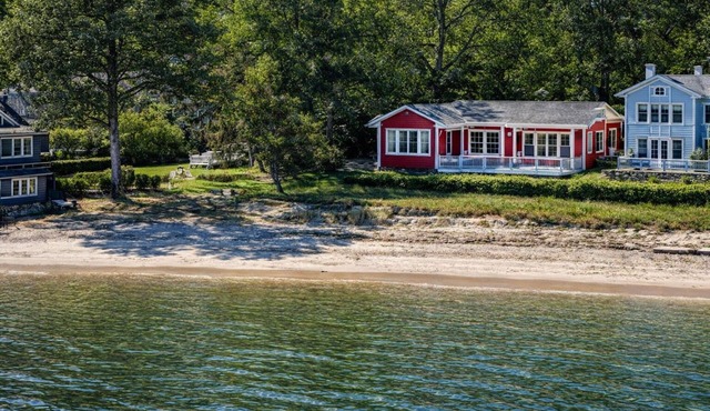Coastal retreat with direct beach access and sweeping Chesapeake Bay water views