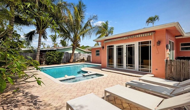 Coastal retreat with heated saltwater pool & spa in prime Delray Beach.
