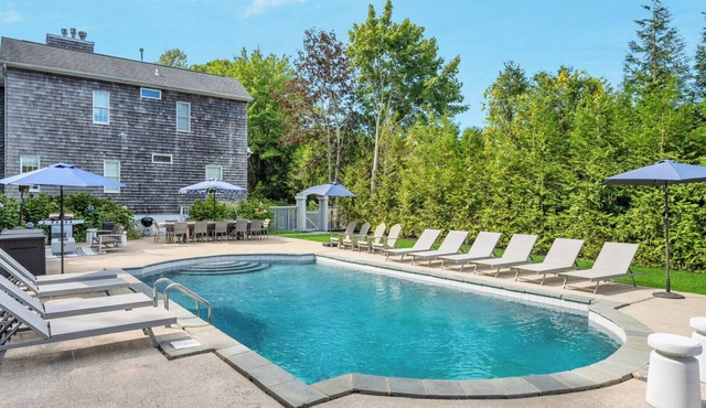 COLONIAL COMPOUND WITH OVERSIZED LIVING ROOMS, GYM, AND ARCADE ROOM, CLOSE.