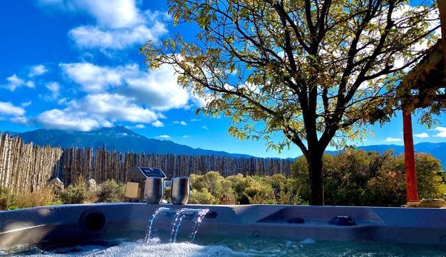 Colorful dog-friendly home with sweeping views, a private hot tub, & large yard