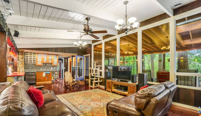 Colorful dog-friendly getaway with covered deck, firepit, fast WiFi, & grill