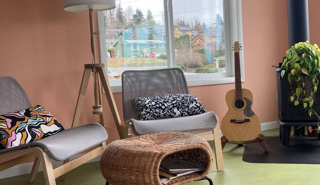 Colorful upstairs studio with lofted bed and soaking tub