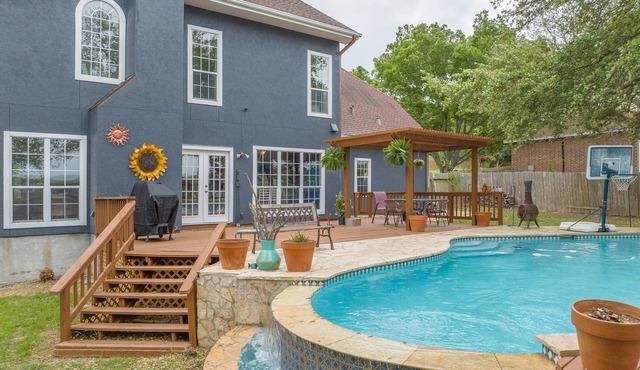 Come enjoy our peaceful house oasis that features a backyard patio with a pool!
