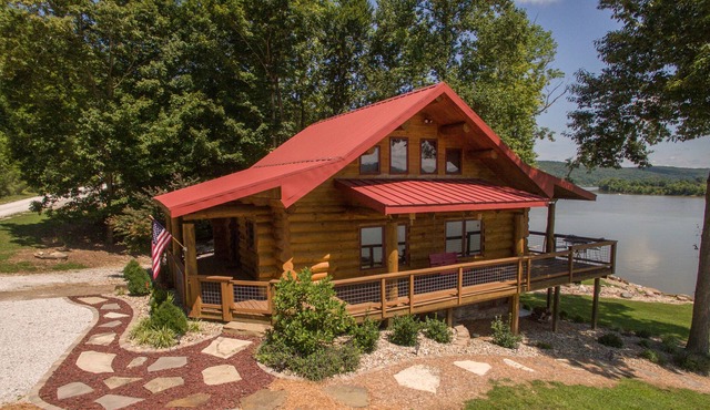 Come sit, relax and unwind on the covered wraparound deck along the River.