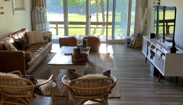 Come stay at a cozy Riverside Retreat with a beautiful sandy beach!