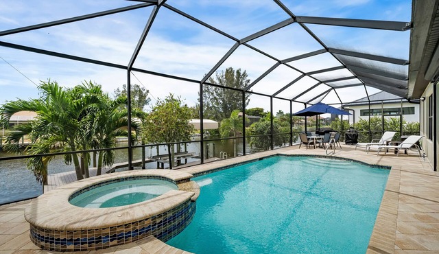 Come visit Boaters Delight in SW Cape-Large Pool/Spa home on canal w/boatlift!