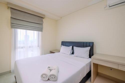 Comfort 1BR Apartment at Pejaten Park Residence By Travelio