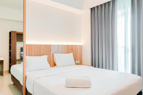 Comfort Living 1BR without Living Room at Bintaro Embarcadero Apartment By Travelio