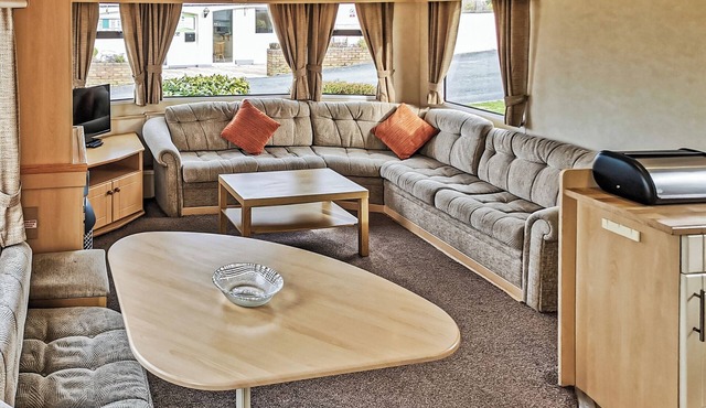 Comfortable and spacious 12ft-wide caravan with one double and one twin.