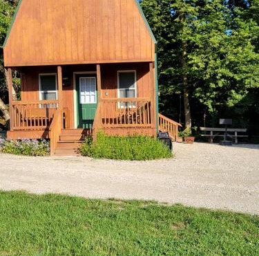 Comfortable Camping Cabins with View of the Cedar River for a Family Weekend Getaway