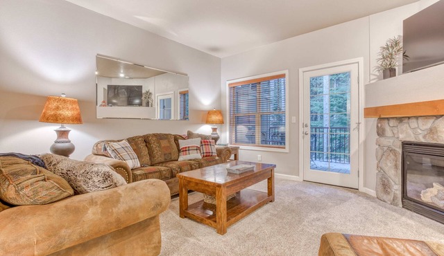 Comfortable condo with fireplace, heated pool, hot tub, balcony & full kitchen