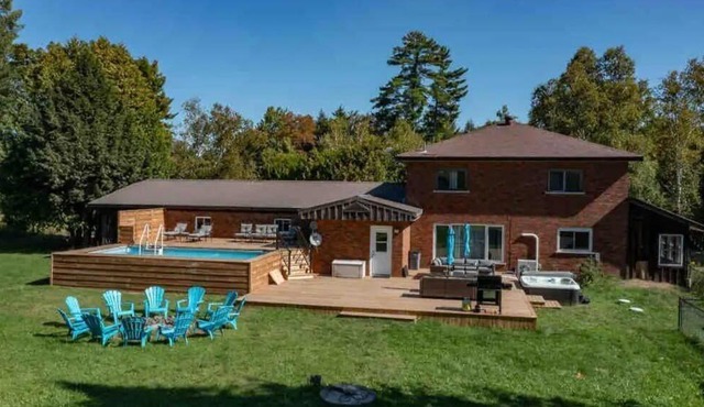 Comfortable cottage for 14 people with pool, hot tub, games, and more.