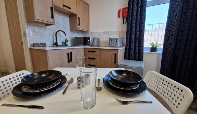 Comfortable Living Space: Flat 2 offers a modern studio apartment