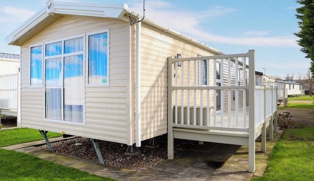 Comfortable modern 12ft-wide caravan with one double and two twin.