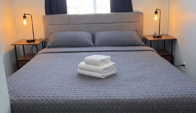 Comfortable Queen Room with a recliner in a Hotel