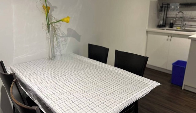 Comfortable Two Bedroom Basement Suite with Full Kitchen Bathroom and Queen Beds