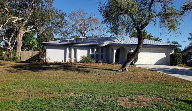 Comfortable updated 3 bedroom home - enclosed, solar heated pool, private yard.