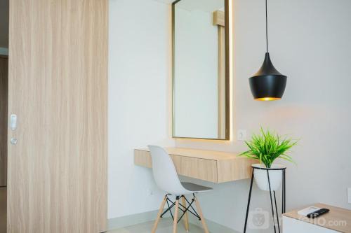 Comfy and Minimalist Studio at Embarcadero Bintaro Apartment By Travelio