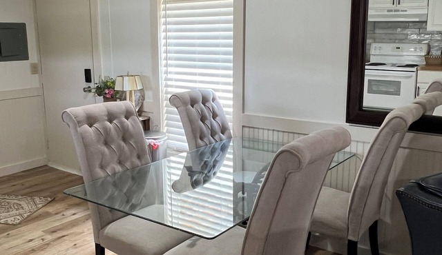 Completely renovated mobile home sitting own a pond.