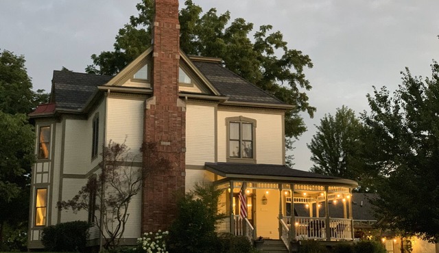 Completely restored 1885 Queen Ann style home located next to the temple lot.