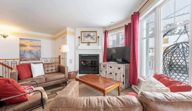 Condo Lac Archambault | Fireplace | beach access