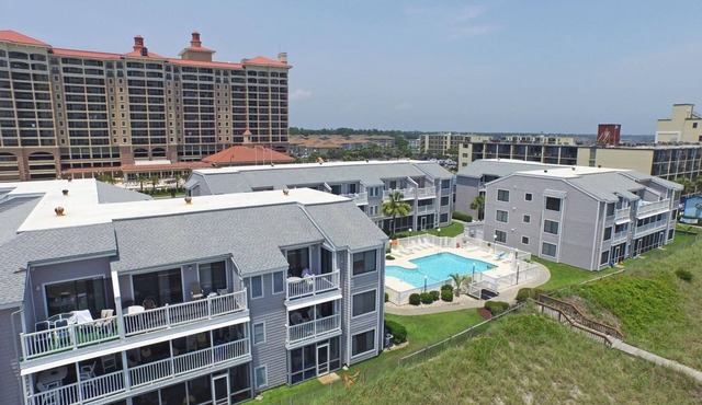 Condo near Golf w/WiFi, Balcony, Resort Pool, Grill, Water Sports & Fishing