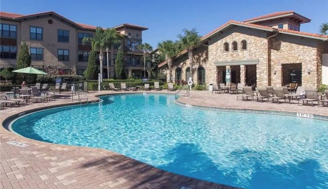 Condo private balcony overlooking the pool close to Disney!