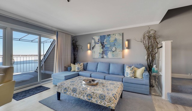 Condo with Lake Charlevoix Views | Private Beach Access | Gas-Log Fireplace