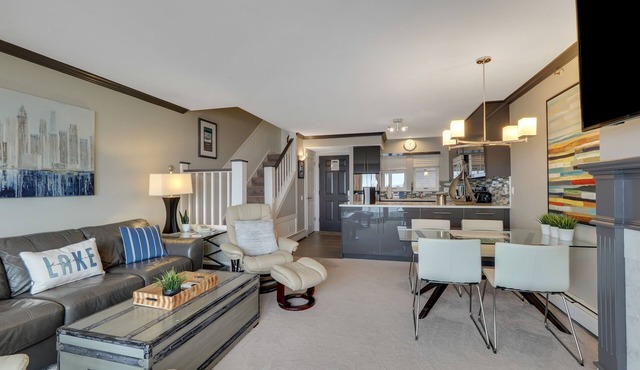 Condo with Lake Charlevoix Views | Private Beach Access | Gas Log Fireplace