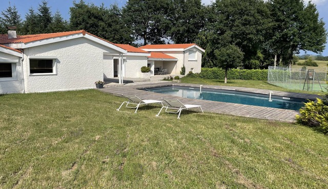Contemporary house with swimming pool and tennis court
