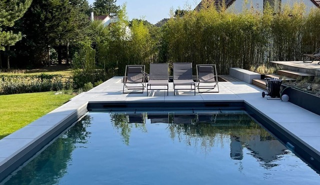 Contemporary wooden villa on the golf course with swimming pool