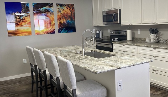 Contemporary 1400 sq ft space in lower level Open concept gas burning fireplace