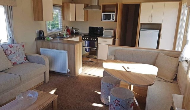 Contemporary 12ft-wide caravan with one double and two twin.