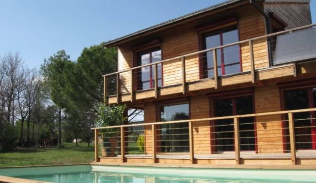 contemporary architect house made of wood in a preserved nature area