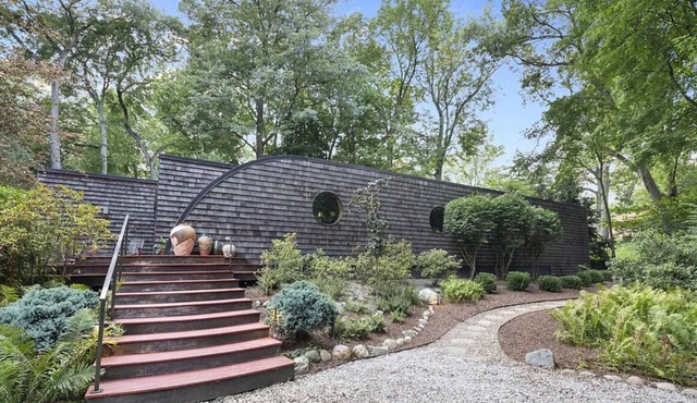 Contemporary house in the woods located two blocks from the beach.