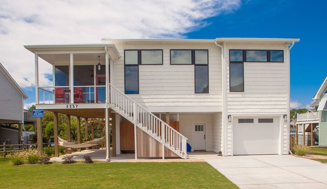 Contemporary home on canal w/elevator, dock, private washer/dryer, central AC