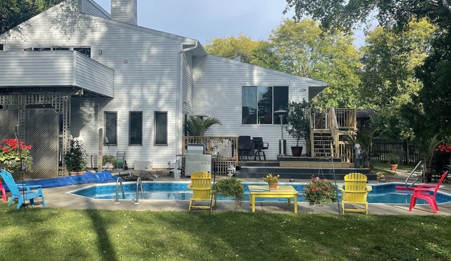 Contemporary home in quiet neighborhood with pool & great back yard close to all