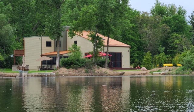 Contemporary home, 4 wooded acres, 200' private lake front, Dock added for 2026!