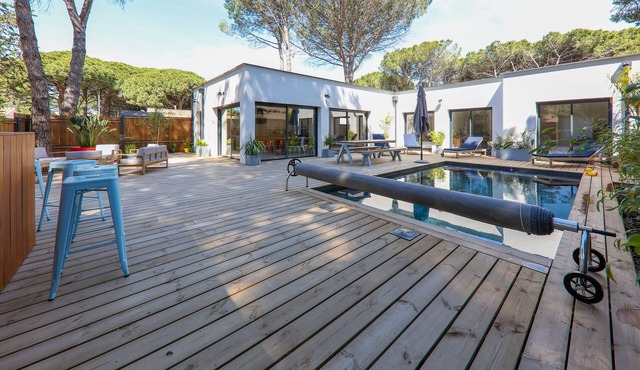 Contemporary house with heated pool in a magnificent pine forest